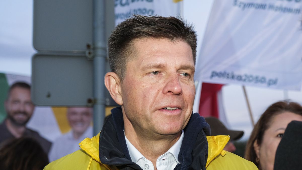 Ryszard Petru, founder of the Nowoczesna party and parliamentary candidate for the Third Way list, center, speaks the the media in Warsaw, Poland, on Monday, Oct. 9, 2023. Poland's main opposition leader Donald Tusk seized on his first election debate in 16 years to attack Prime Minister Mateusz Morawiecki over graft and real estate deals without landing a killer blow. Photographer: Damian Lemaski/Bloomberg via Getty Images