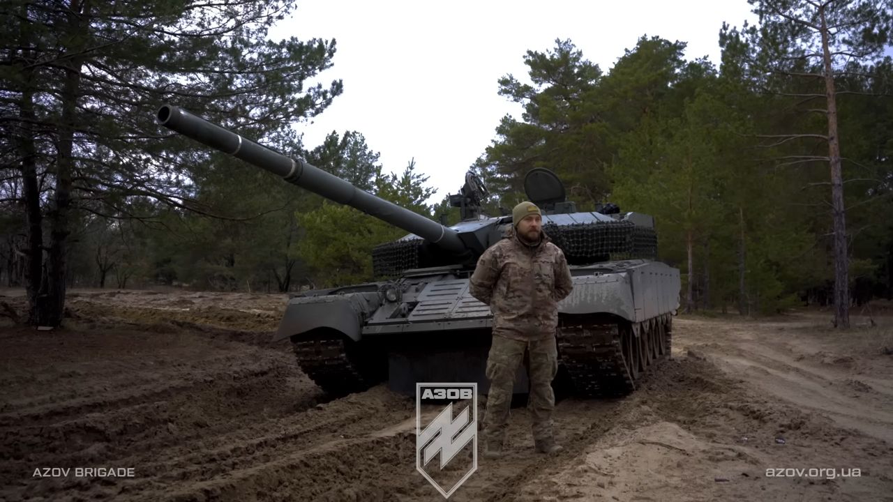 A Ukrainian soldier on modified T-80U tanks.