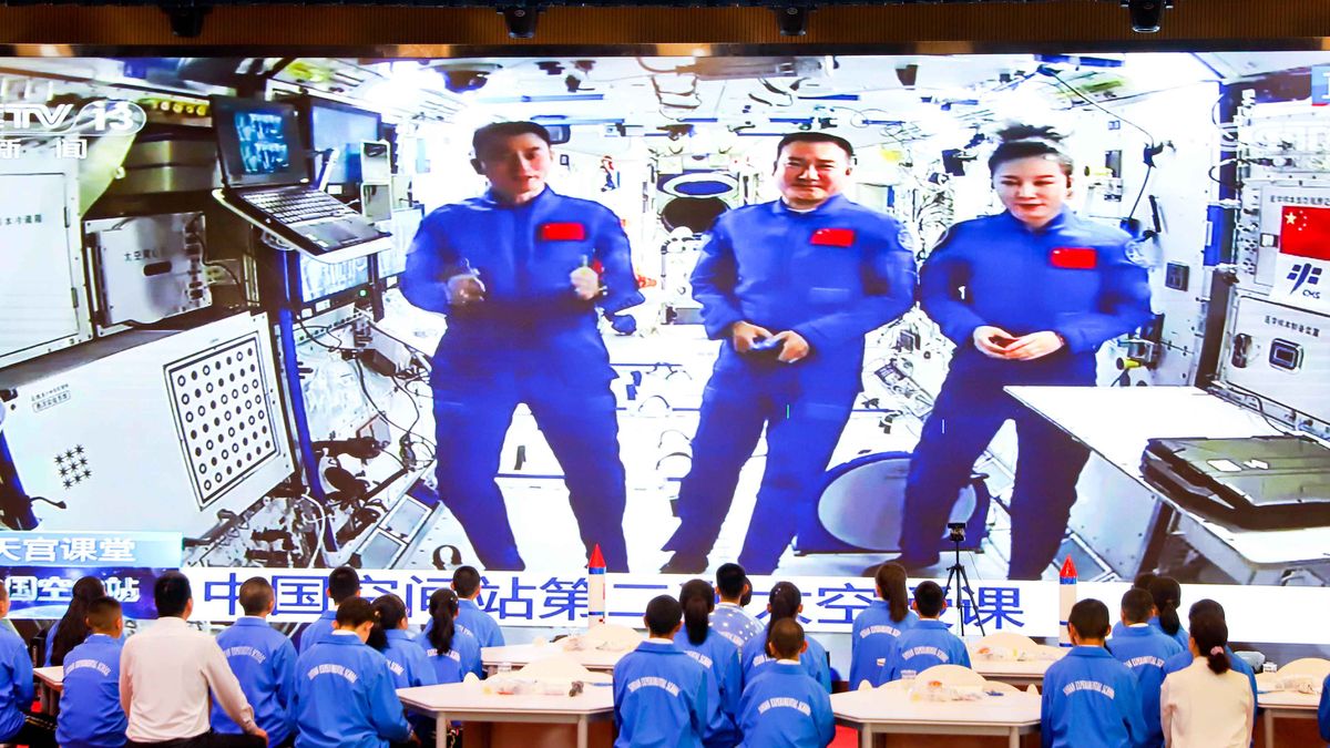 ZHANGYE, CHINA - MARCH 23 2022: Students watch a televised lecture by the three astronauts on the Chinese space station Tiangong in a school in Zhangye in northwest China's Gansu province Wednesday, March 23, 2022. (Photo credit should read XUE LEI/Future Publishing via Getty Images)