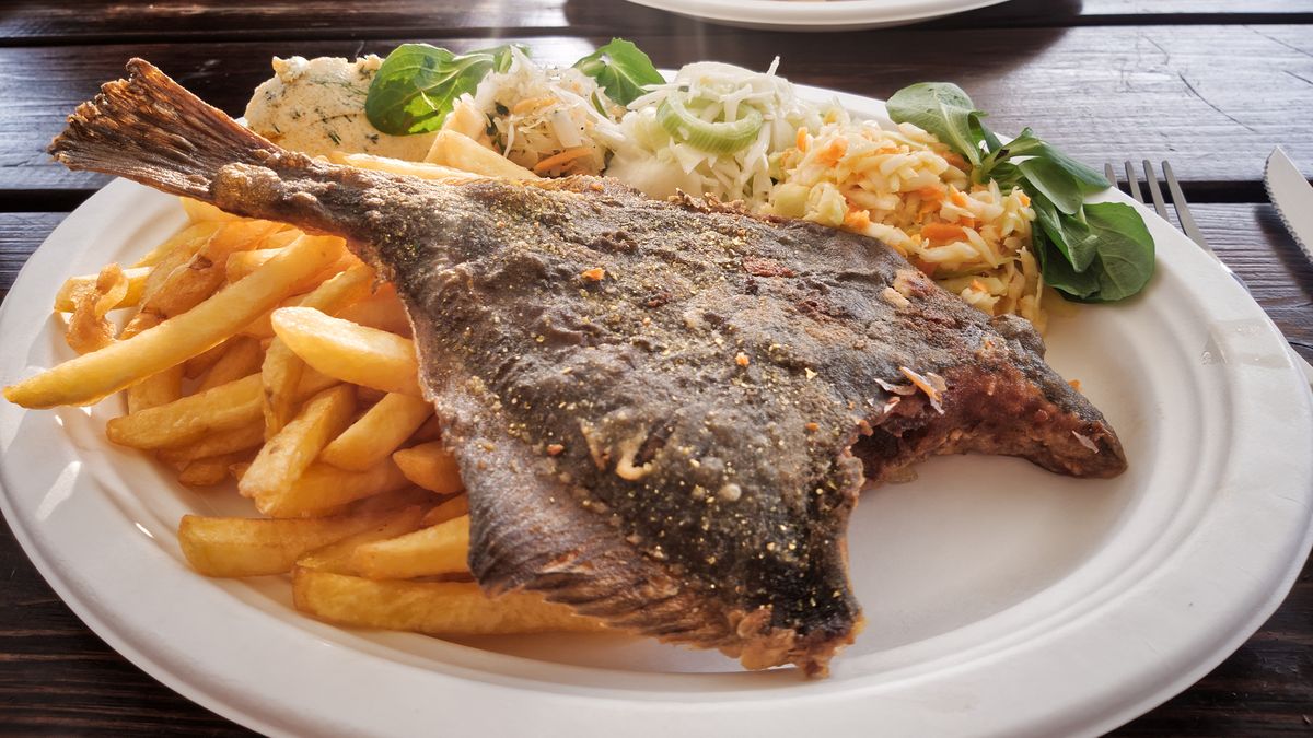 Fried flounder fish with French fries and salad.
Fried flounder fish with French fries and fresh salad.
PATSTOCK