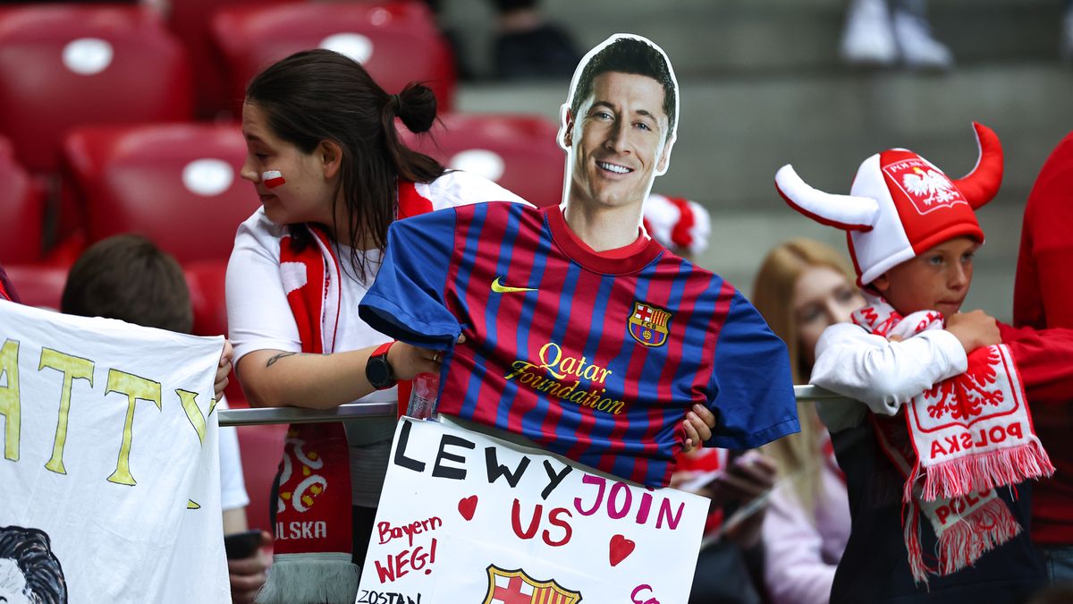 WARSAW, POLAND - JUNE 14: A fan of Poland holds up a cardboard cut out of Robert Lewandowski of Poland in a Barcelona shirt during the UEFA Nations League League A Group 4 match between Poland and Belgium at PGE Narodowy on June 14, 2022 in Warsaw, Poland. (Photo by Robbie Jay Barratt - AMA/Getty Images)