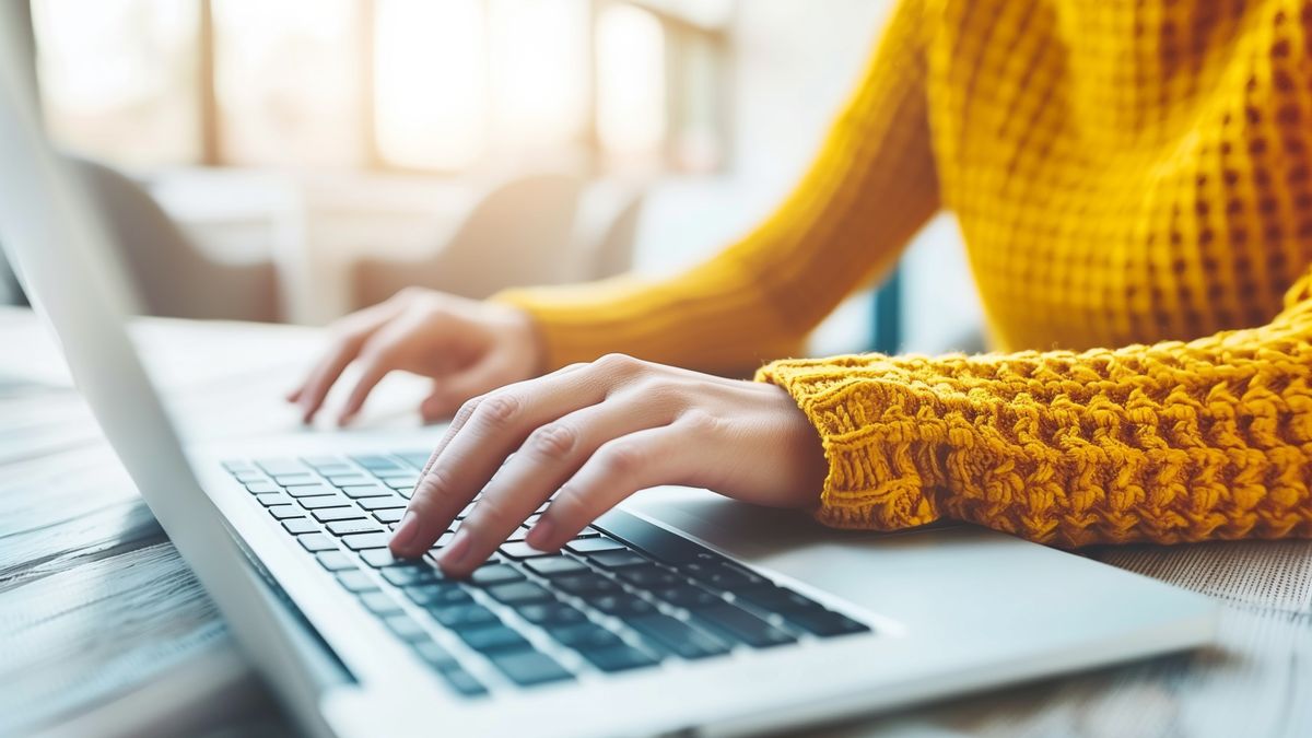 A woman is typing on a laptop in a yellow sweaterA woman is typing on a laptop in a yellow sweater. She is focused on her work and she is in a serious moodlaptop, computer, technology, typing, business, internet, office, online, woman, workplace, keyboard, using, female, person, job, working, notebook, hands, communication, lifestyle, table, information, freelance, businesswoman, desktop, student, desk, closeup, network, occupation, wireless, indoors, web, home, device, connection, sitting, workspace, learning, pc, modern, young, coffee, education, caucasian, finger, digital, busy, cyberspace, writing, laptop, computer, technology, typing, business, internet, office, online, woman, workplace, keyboard, using, female, person, job, working, notebook, hands, communication, lifestyle, table, information, freelance, businesswoman, desktop, student, desk, closeup, network, occupation, wireless, indoors, web, home, device, connection, sitting, workspace, learning, pc, modern, young, coffee, education, caucasian, finger, digital, busy, cyberspace