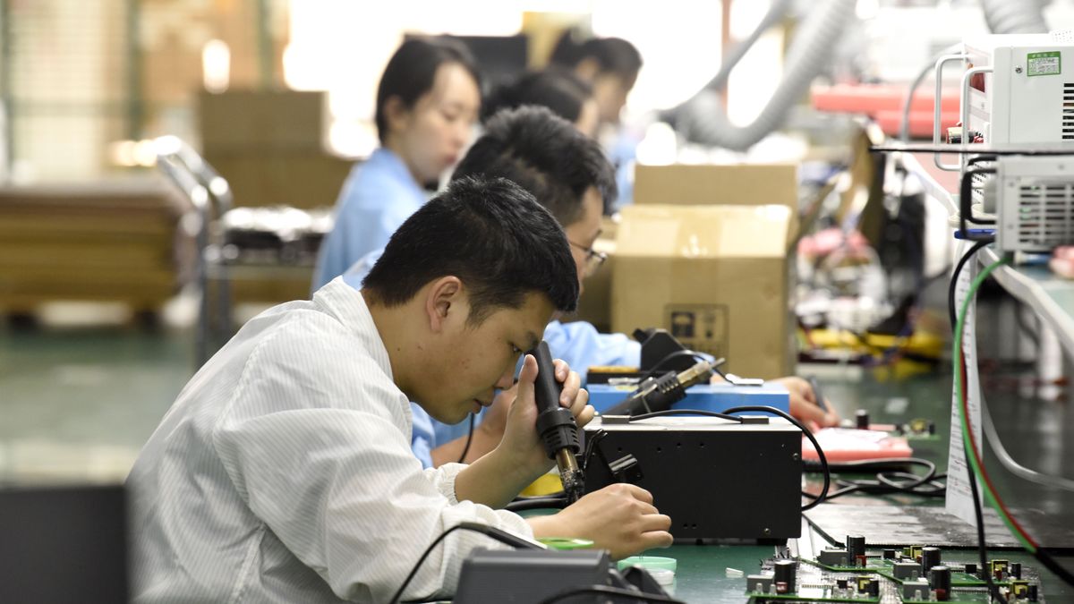 FUYANG, CHINA - JUNE 24, 2025 - Staff members were installing chips, resistors and other components one by one on circuit boards in the workshop in Fuyang City, Anhui Province, China on June 24, 2025. (Photo credit should read CFOTO/Future Publishing via Getty Images)