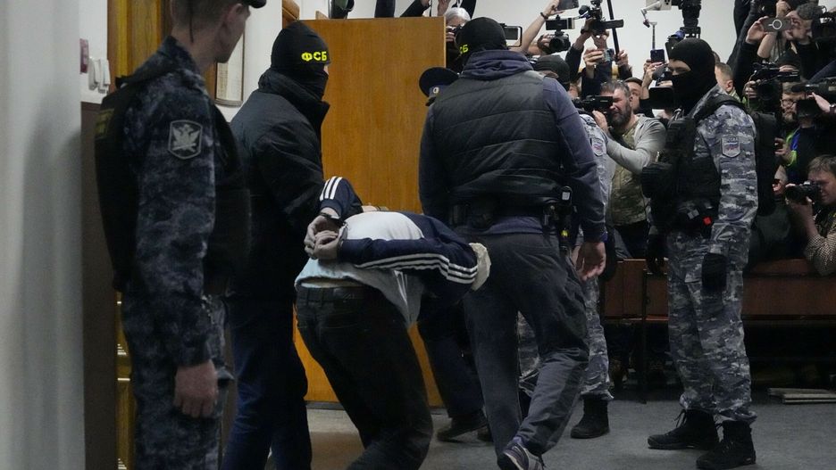 Temporary
A suspect in the Crocus City Hall shooting on Friday, is escorted by police officers in the Basmanny District Court in Moscow, Russia, Sunday, March 24, 2024. (AP Photo/Alexander Zemlianichenko)
Alexander Zemlianichenko