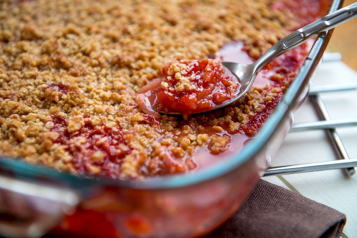 I'm cutting rhubarb and sprinkling it with crumble. My family asks me for this dessert every other day.
