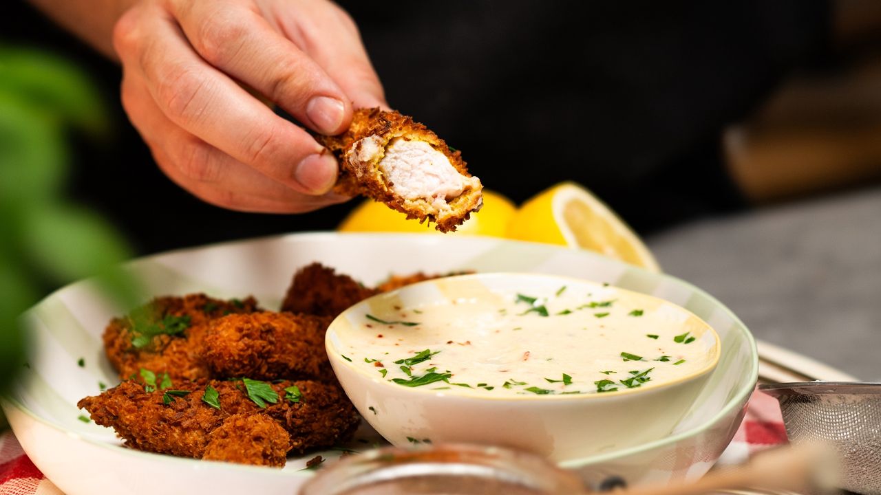 Coconut-crusted chicken strips with tangy pineapple dip