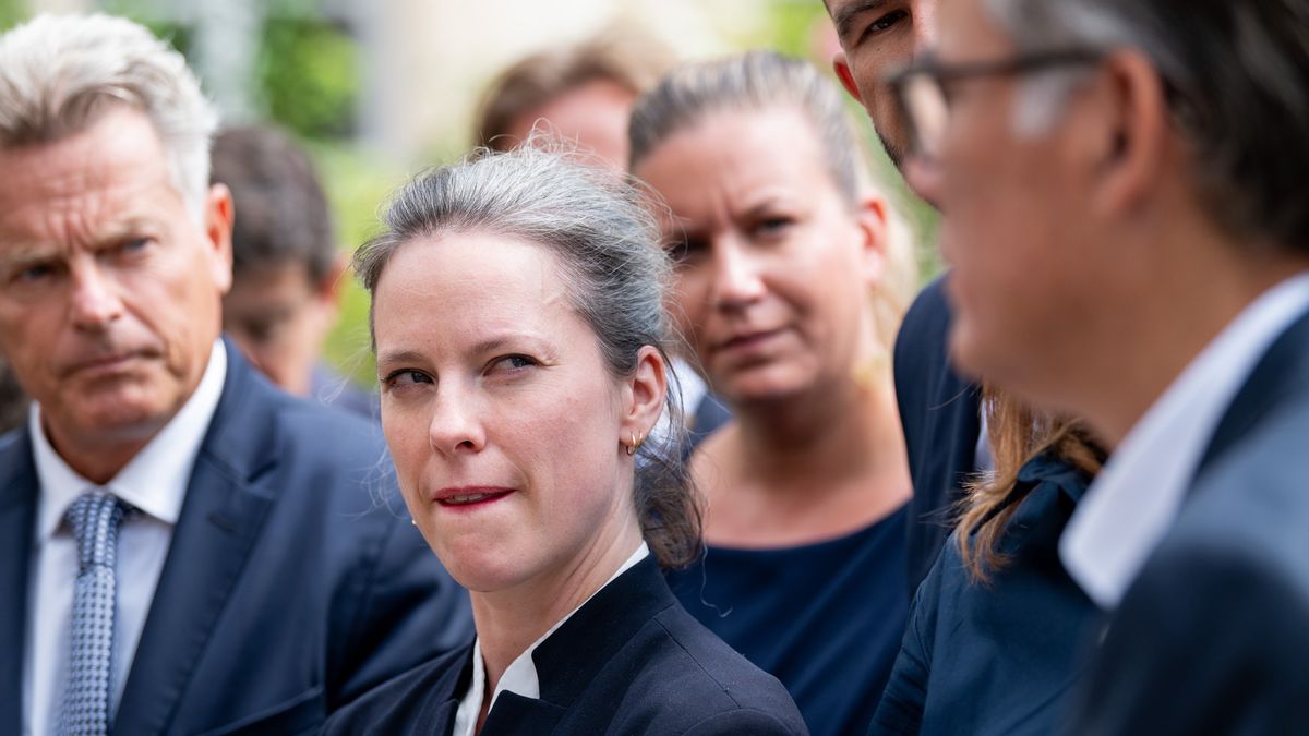 Lucie Castets, member of the New Popular Front, center, and other party representatives leave after talks with French President Emmanuel Macron, at the Elysee Palace in Paris, France, on Friday, Aug. 23, 2024. Macron is meeting with political parties and delegations after snap elections that left him weaker than before, with a hostile National Assembly that has no majority. Photographer: Benjamin Girette/Bloomberg via Getty Images