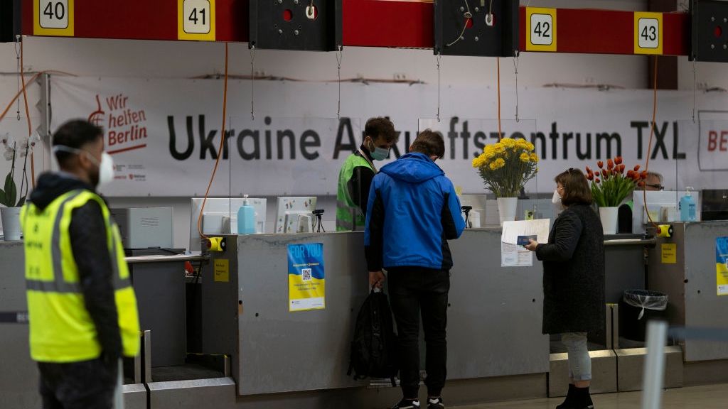 Berlin Struggles To Accommodate New Refugees
BERLIN, GERMANY - MAY 19: Refugees from Ukraine talk to workers at welcome center at former Tegel airport on May 19, 2023 in Berlin, Germany. Authorities are expecting 10,000-12,000 new refugees to arrive in the Berlin this year, well below the record number of 95,000 the city registered last year but pushing its already strained capacity nonetheless. Berlin lacks sufficient accommodation as well as open spots in schools for refugee children. (Photo by Maja Hitij/Getty Images)
Maja Hitij