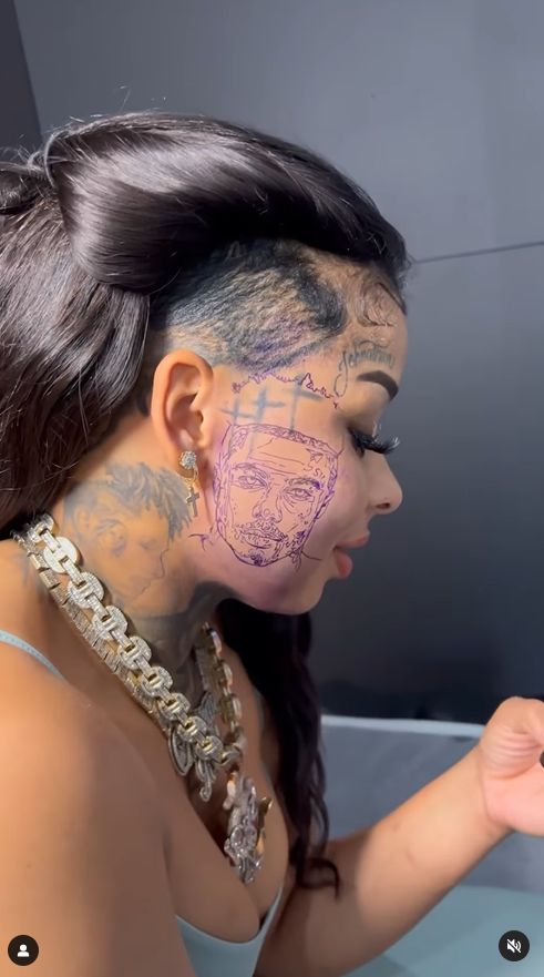She tattooed her partner's face on her cheek.