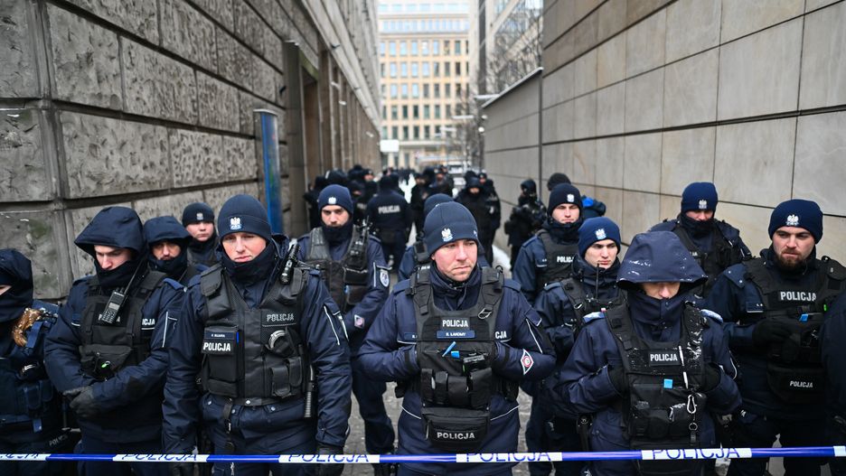 WARSAW, POLAND - JANUARY 11: Police officers block the entrances of the Television Information Agency (part of the Public Television, TVP assets network) after the liquidator of the Public television decided to close the building of the Television Information Agency on January 11, 2024 in Warsaw, Poland. After Poland's new culture minister dismissed the heads of the state television channel TVP and Polish Radio, following media reforms instituted by new PM Donald Tusk to "depoliticize public media", MPs from the Law and Justice (PiS) that lost power last year reacted by staging a sit-in at the state TV Television Information Agency. (Photo by Omar Marques/Getty Images)