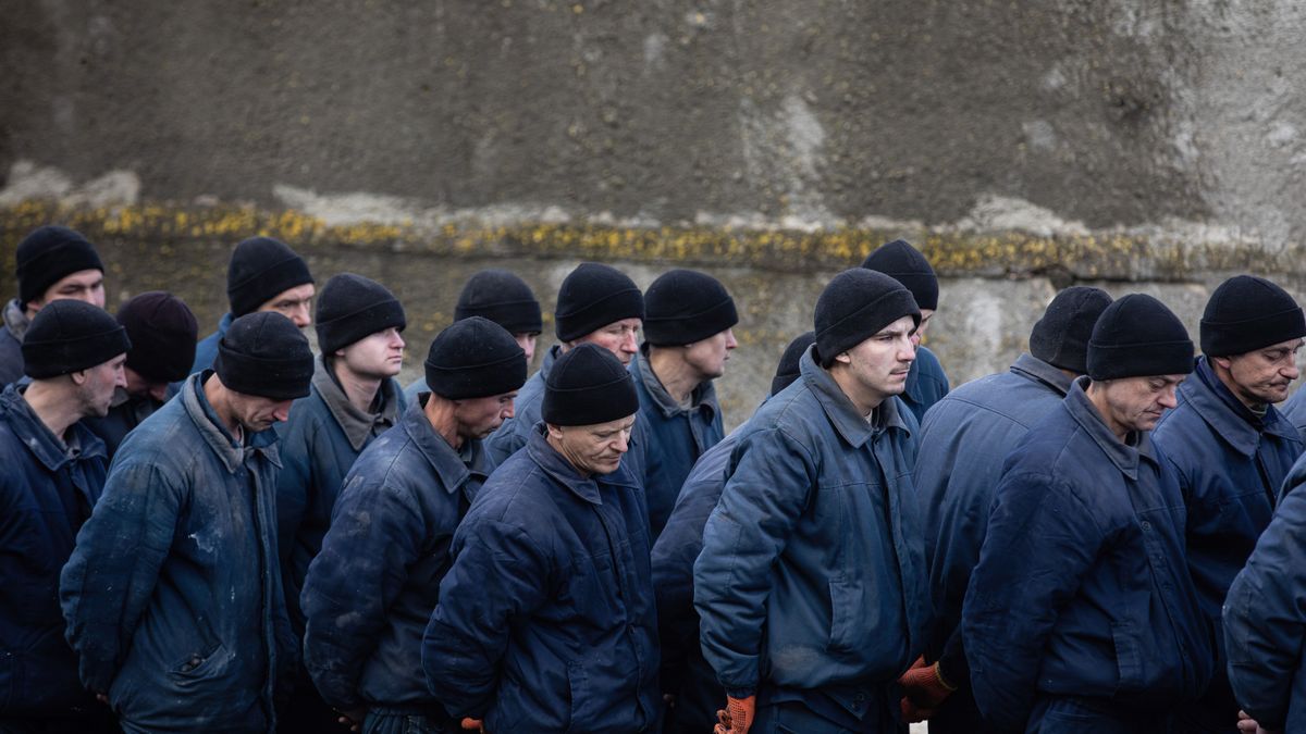 UKRAINE - 2023/01/17: A group of Russian prisoners of war in a Ukrainian colony for war criminals. Total number of POWs in the camp not disclosed. Most of the prisoners in the colony are planned to be exchanged. However, criminal proceedings have already been opened against some of them for war crimes. Russia's full-scale invasion of Ukraine has been going on for more than 1 year. However, the number of prisoners from both sides is still not reliably known. Experts believe we are talking about thousands of prisoners of war. The Ukrainian military has repeatedly spoken about torture, beatings and violence in Russian captivity - no official reaction of the Russian authorities to this is known. Ukraine, unlike Russia, has granted the UN access to the POWs and also launched an investigation into the ill-treatment of the detected cases. Most Russian POWs are held in Ukraine in special camps visited by representatives of international human rights organisations. (Photo by Mykhaylo Palinchak/SOPA Images/LightRocket via Getty Images)