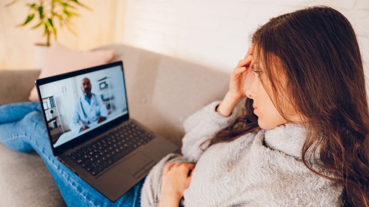 A woman having Video call with doctor
Young beautiful woman having video call with doctor using laptop at home
Vilin Visuals