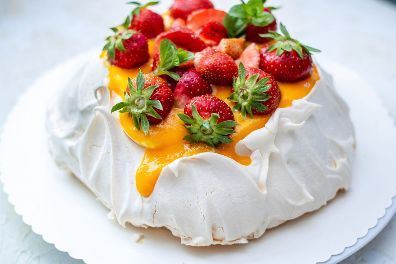 Meringue magic: Elevate your celebration with mango and strawberry delight