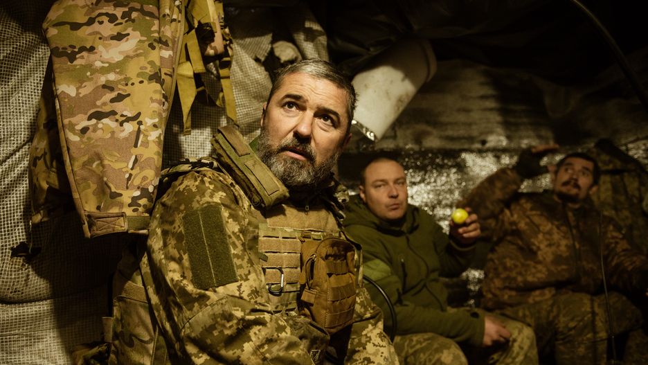 DONETSK OBLAST, UKRAINE - DECEMBER 01: Drone team of the 58th Mechanized Brigade of the Ukrainian army, drone operators, Oleksyi and Volodymyr, and former mayor of Uman Oleksandr Tsebriy (L) are seen inside a hut as Russian attacks on the city of Vuhledar continue in Donetsk Oblast, Ukraine on December 01, 2023. (Photo by Andre Alves/Anadolu via Getty Images)