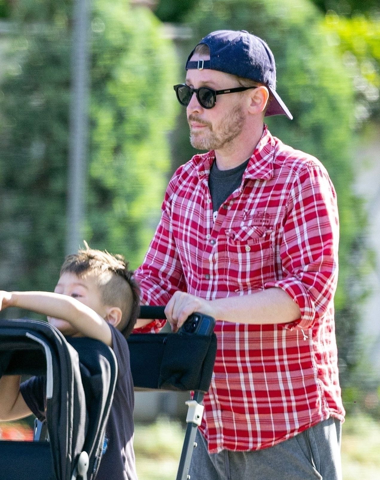 Macaulay Culkin on a family walk