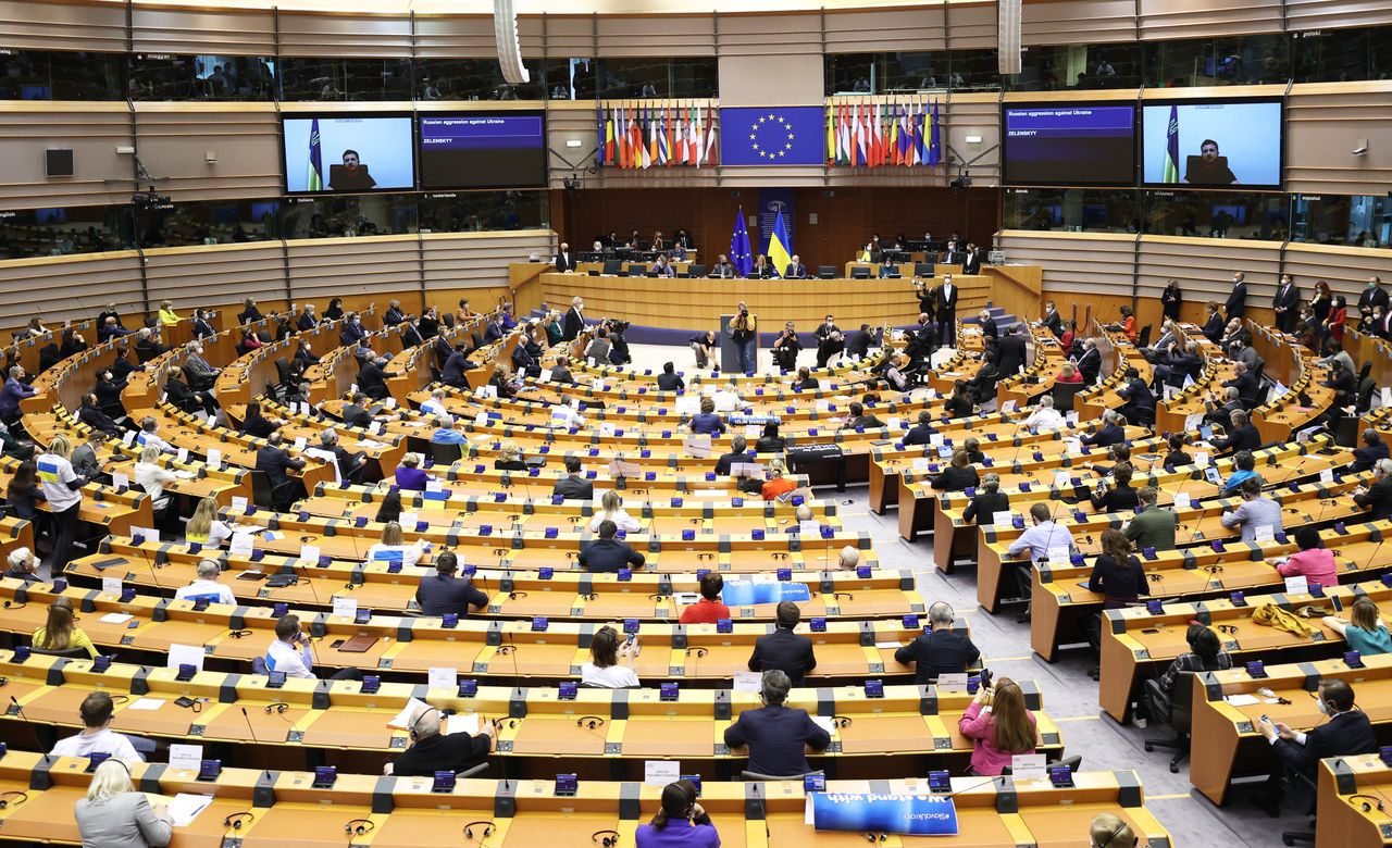 BRUSSELS, BELGIUM - MARCH 1: Ukrainian President Volodymyr Zelensky (on screen) gives a live video address during a special plenary session of the European Parliament focused on the Russian invasion of Ukraine at the EU headquarters in Brussels, on March 1, 2022. - The European Commission has opened the door for Ukraine to join the EU, but this is not for tomorrow, despite Kiev's request for a special procedure to integrate the country "without delay". (Photo by Dursun Aydemir/Anadolu Agency via Getty Images)