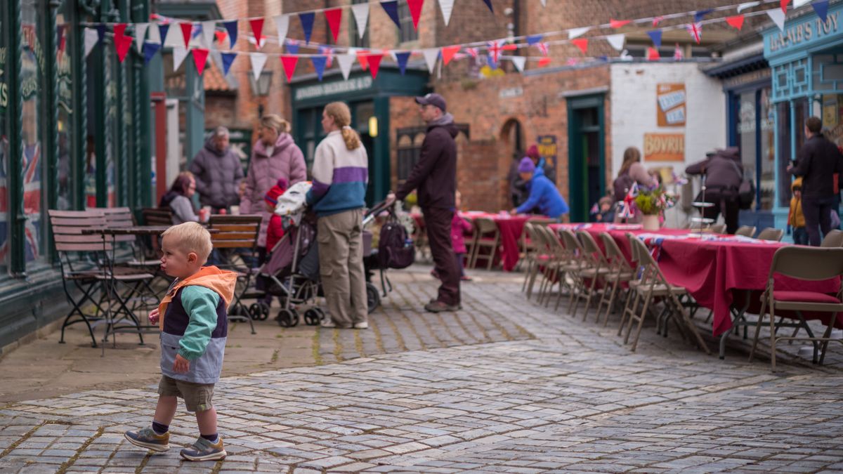 STOCKTON-ON-TEES, UNITED KINGDOM - MAY 05: Visitors to Preston Park Museum enjoy a VE Day themed picnic area on May 05, 2025 in Stockton-on-Tees, United Kingdom. Street parties are being organized by local communicates around the country in celebration of the 80th Anniversary of VE Day (Victory in Europe Day), which saw people taking to the streets in jubilation on May 8, 1945, marking the end of World War II. (Photo by Ian Forsyth/Getty Images)