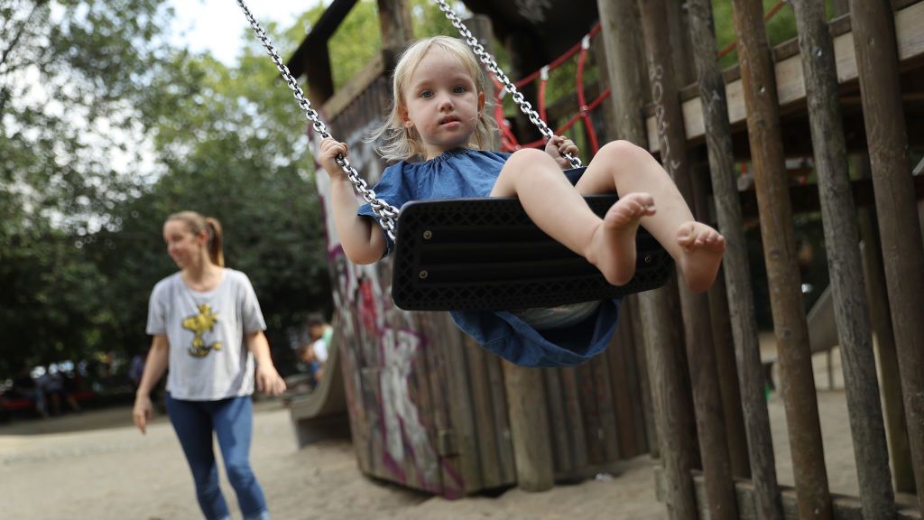 Political Parties Debate Child Benefits
BERLIN, GERMANY - AUGUST 31:  (EDITOR'S NOTE: Subject agreed to be photographed). Heidi, 2, gets a push on a swing from her mother Anna at a playground on August 31, 2017 in Berlin, Germany. With approximately three weeks to go before federal elections in Germany political parties are debating Germany's child benefits policy. Known in German as "Kindergeld," parents receive monthly money from the state for each child as a form of subsidy to encourage families to have children. Germany suffered from a falling birthrate for decades, a phenomenon that has reversed in recent years.  (Photo by Sean Gallup/Getty Images)
Sean Gallup
Kindergeld, child support, children, child