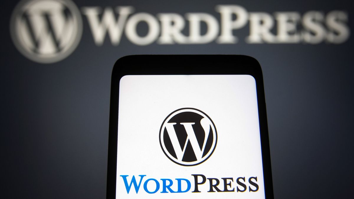 UKRAINE - 2021/11/22: In this photo illustration, the WordPress (WP, WordPress.org) logo is seen on a smartphone and in the background. (Photo Illustration by Pavlo Gonchar/SOPA Images/LightRocket via Getty Images)