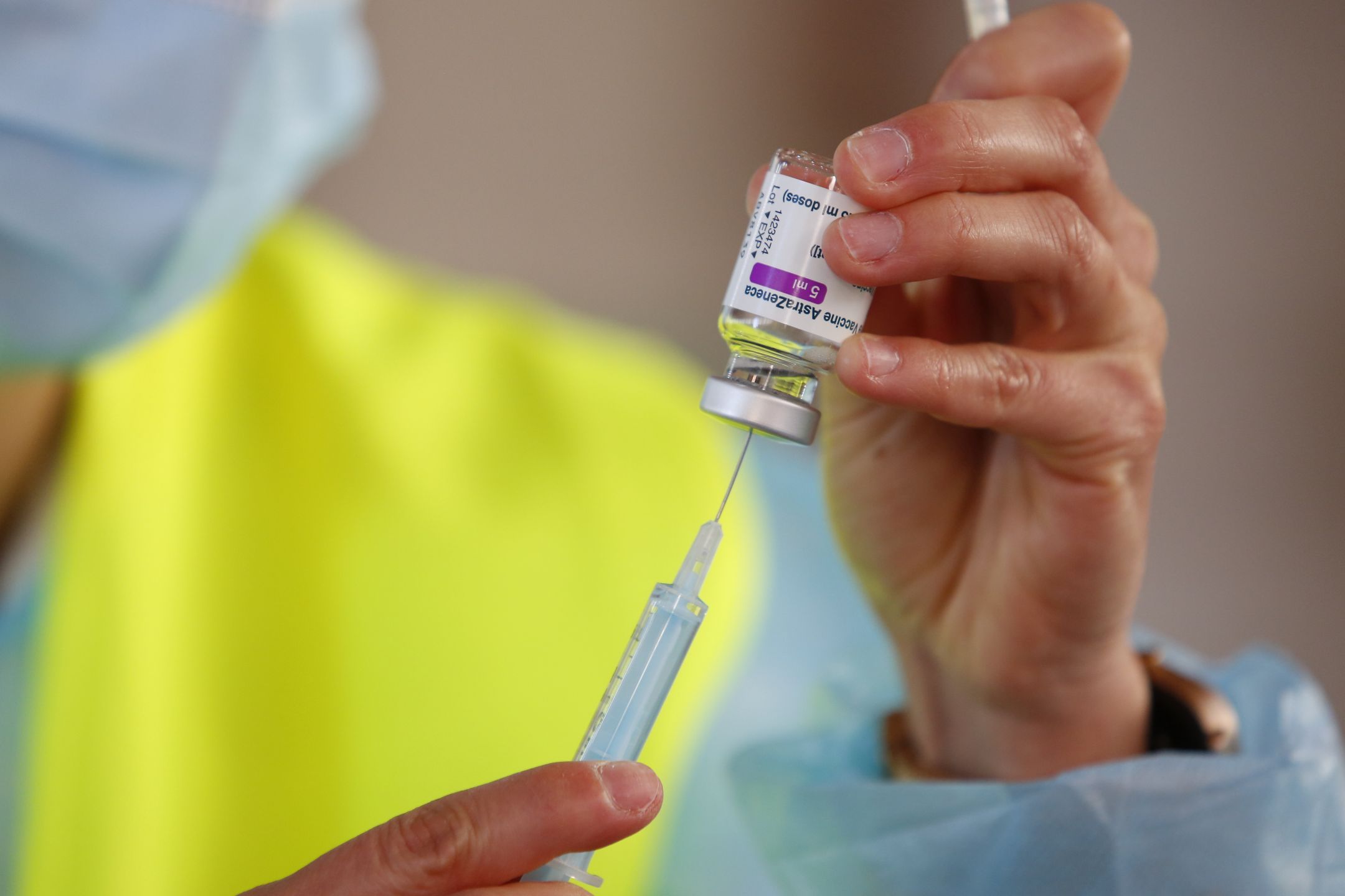 A nurse prepares an AstraZeneca vaccine from a vial after this vaccine was approved again in Spain. The massive vaccination against COVID-19 continues in Granada, Spain, on March 25, 2021. (Photo by Álex Cámara/NurPhoto via Getty Images)