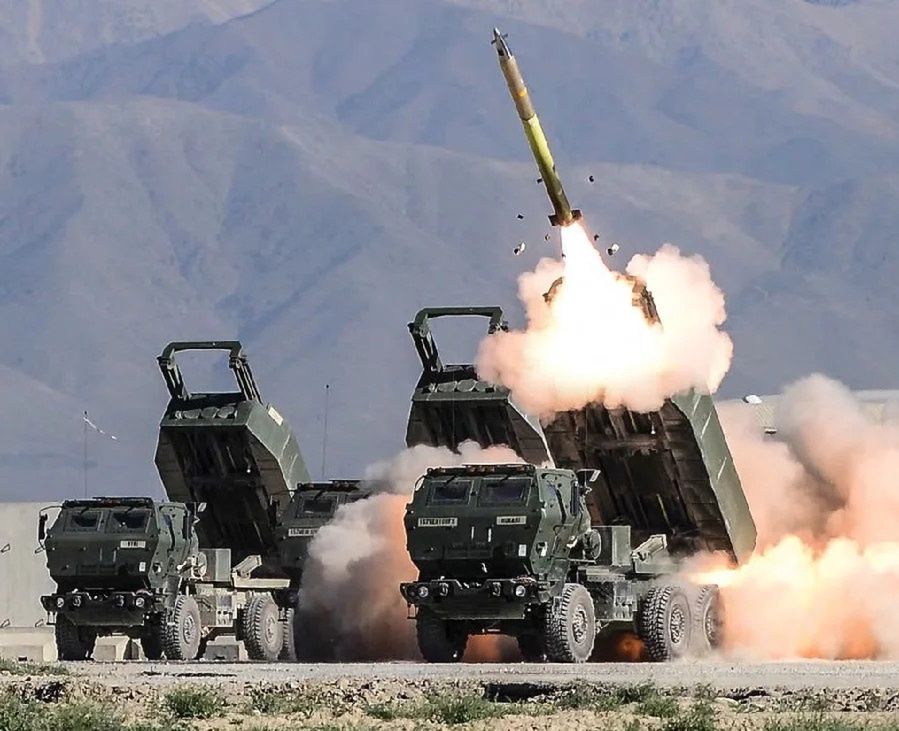 M142 HIMARS launcher firing ATACMS missiles
