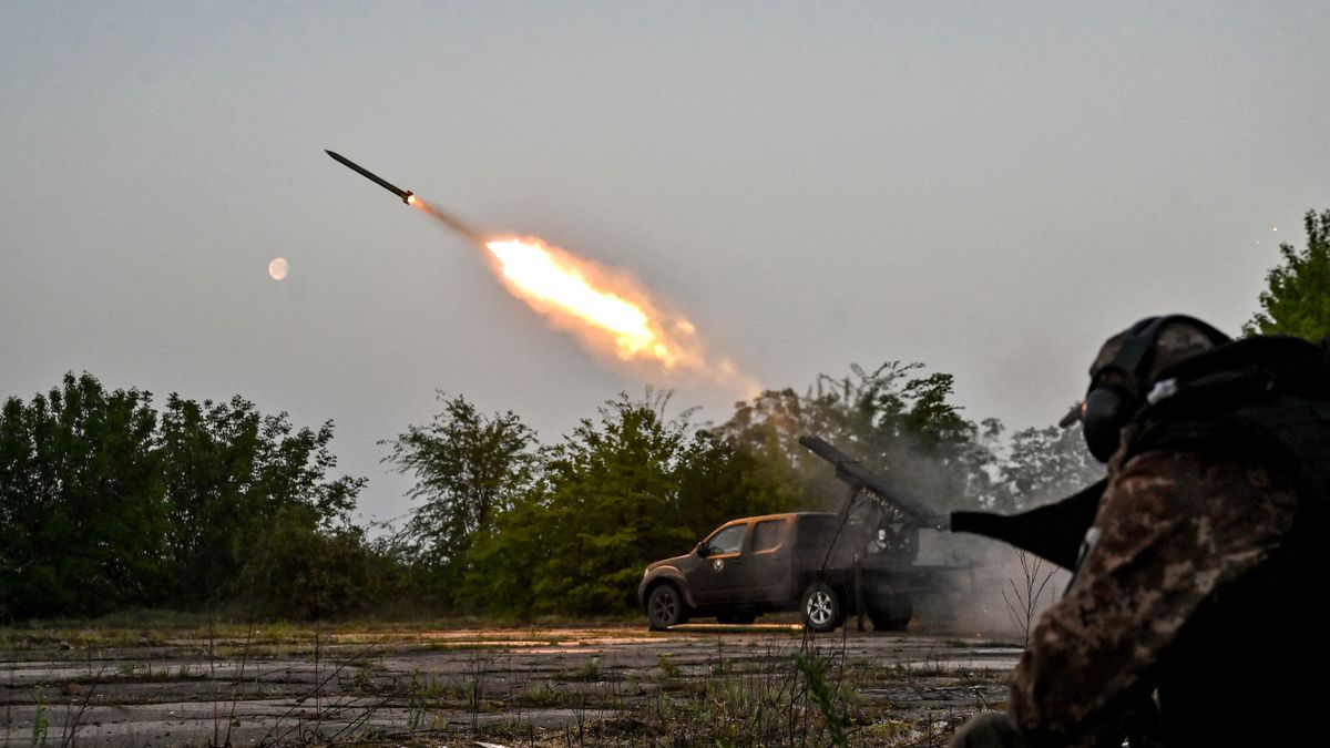 ZAPORIZHZHIA REGION, UKRAINE - APRIL 27, 2024 - A serviceman of the Steppe Wolves all-volunteer unit is seen near a pickup truck equipped with Grad rocket launch tubes captured from Russian troops and a sighting device on a combat mission, Zaporizhzhia Region, southeastern Ukraine.  (Photo credit should read Dmytro Smolienko / Ukrinform/Future Publishing via Getty Images)