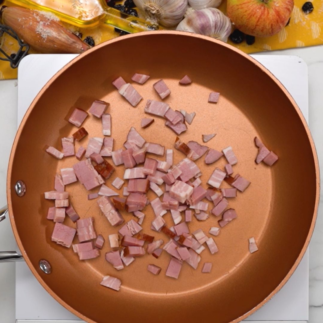 Bacon lands in the pan first.