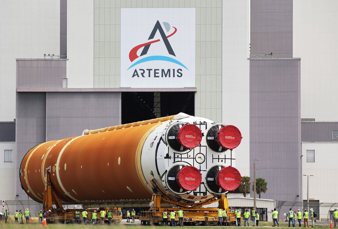 The Core Stage for NASA's Space Launch System rocket is moved from the Pegasus barge to the Vehicle Assembly Building at Kennedy Space Center in Cape Canaveral, Florida, on July 23, 2024. NASA delayed the Artemis III moon landing to 2027. (Ricardo Ramirez Buxeda/Orlando Sentinel/Tribune News Service via Getty Images)