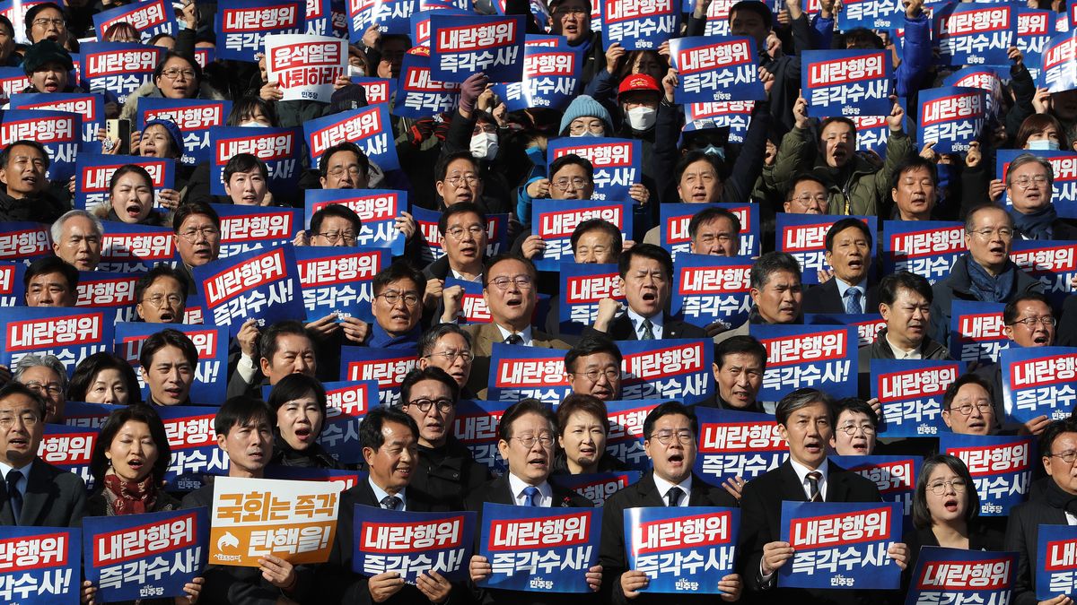 SEOUL, SOUTH KOREA - DECEMBER 04: South Korea's main opposition Democratic Party (DP) leader Lee Jae-myung and party members participate in a rally against the country's president at the National Assembly on December 04, 2024 in Seoul, South Korea. South Korean lawmakers voted to lift the declaration of emergency martial law announced earlier by President Yoon Suk Yeol in a televised speech. Since taking office two years ago, Mr Yoon has struggled to push his agendas against an opposition-controlled parliament. (Photo by Chung Sung-Jun/Getty Images)