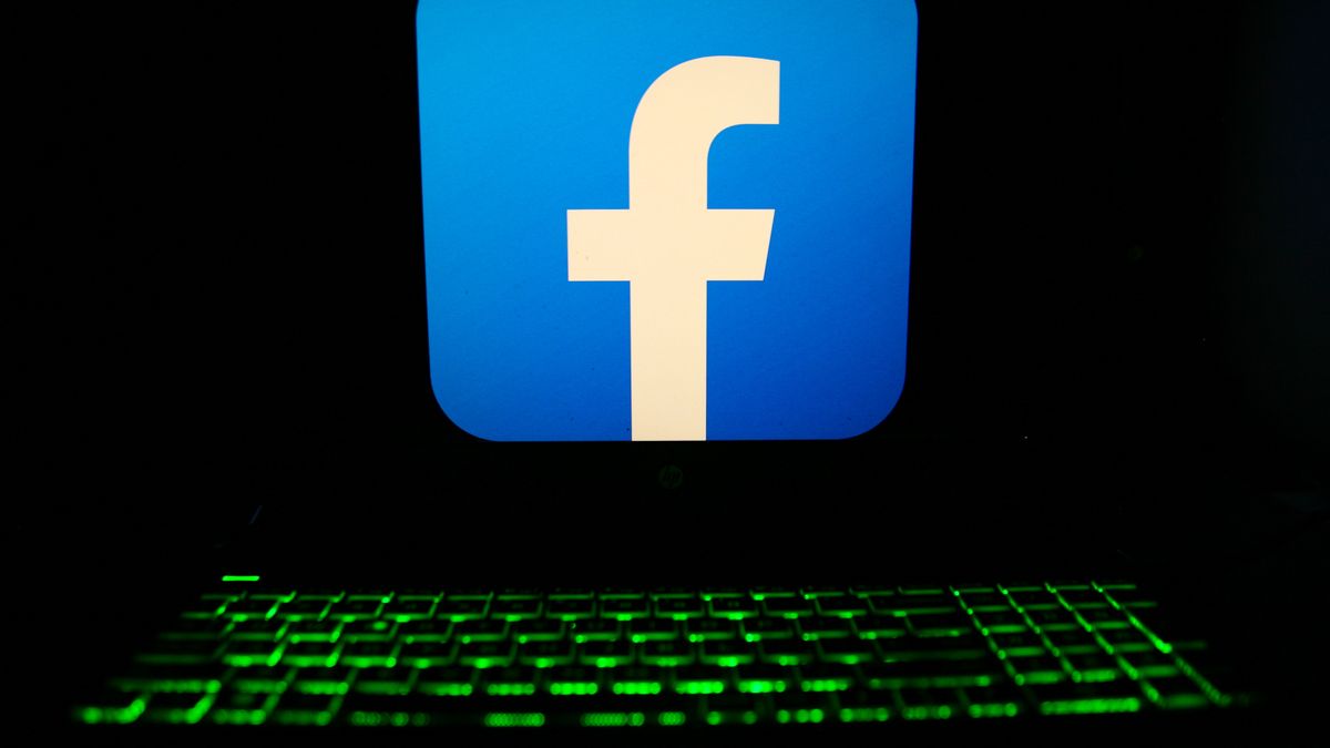 The Facebook logo is displayed on a laptop screen with a glowing keyboard in Krakow, Poland, on March 3, 2024. (Photo by Klaudia Radecka/NurPhoto via Getty Images)