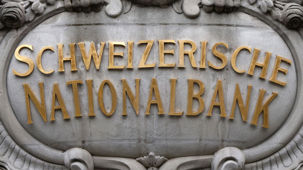 A sign above the entrance to the Swiss National Bank (SNB) ahead of the bank's rate announcement news conference in Zurich, Switzerland, on Thursday, Dec. 14, 2023. With Switzerland facing the weakest growth in four years for 2024, inflation now down to 1.4%, and the franc close to at an eight-year high against the euro, the central bank is in a holding pattern. Photographer: Stefan Wermuth/Bloomberg via Getty Images