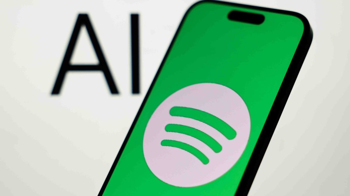 AI sign displayed on a laptop screen and Spotify logo displayed on a phone screen are seen in this illustration photo taken in Krakow, Poland on February 4, 2026. (Photo by Jakub Porzycki/NurPhoto via Getty Images)
