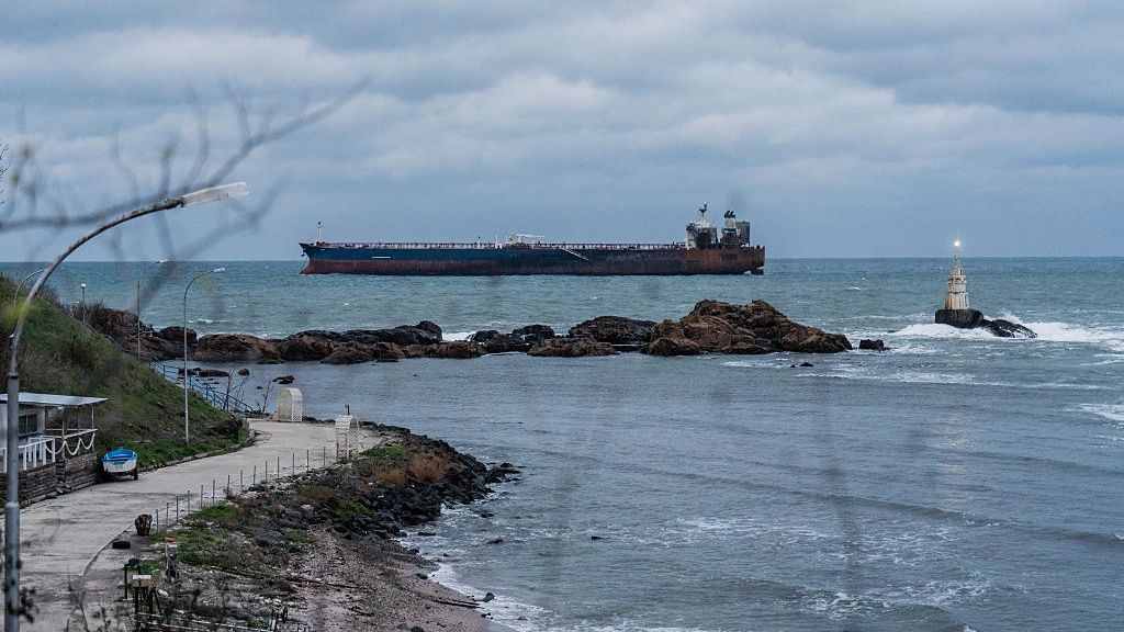 Kairos Tanker, EU-Sanctioned Vessel Damaged In Alleged Drone Attack, Stranded Off Bulgarian Coast
AHTOPOL, BULGARIA - DECEMBER 8: The Kairos oil tanker, a Gambian-flagged vessel believed to be part of Russia's shadow fleet, remains anchored on December 8, 2025 in Ahtopol, Bulgaria. Last week, the ship was sailing from Egypt toward the Russian port of Novorossiysk when it caught fire after an alleged attack by Ukrainian naval drones. Bulgarian maritime authorities are planning the evacuation of the remaining crew. The tanker was sanctioned by the European Union in July for its involvement in Russia's so-called shadow fleet, a clandestine network of vessels that help the country skirt price-capping sanctions on Russian oil sales, penalties that were imposed after the 2022 invasion of Ukraine. (Photo by Hristo Rusev/Getty Images)
Hristo Rusev