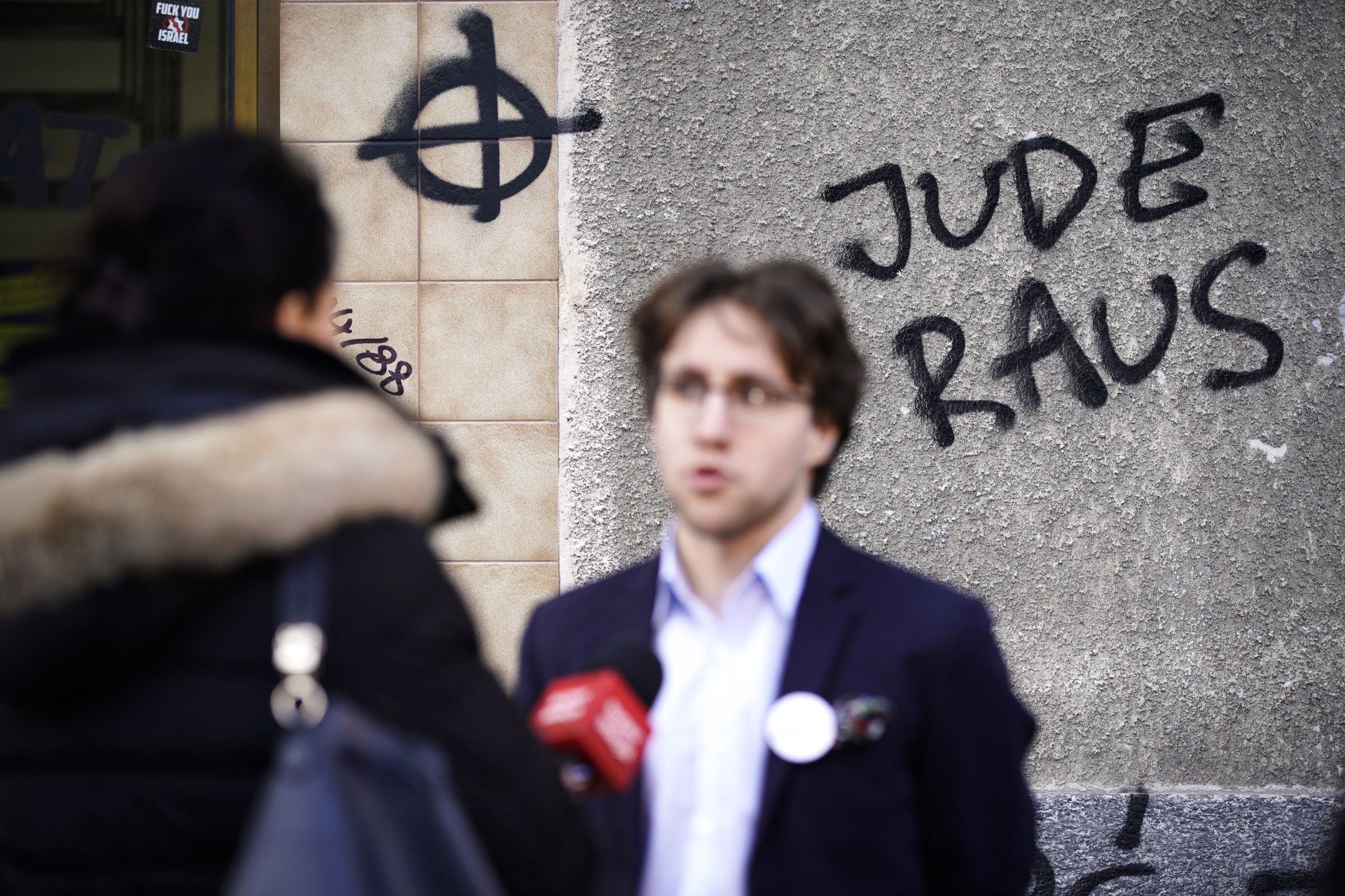 Citizens Of Poland Office Vandalised With Hate SymbolsMedia representative Michal Szymanderski-Pastryk speaks to a television crew in front of the office of the civic action committee Obywatele RP (Citizens of Poland) in Warsaw, Poland on February 25, 2019. The Obywatele RP office entrance has been besmirched with hate propaganda over the weekend including anti-Semitic texts and symbols and white power symbols. (Photo by Jaap Arriens/NurPhoto via Getty Images)NurPhotoIsrael, Warsaw, action, anti-semitism, celtic cross, democracy, discrimination, facism, gallows, graffiti, hangman, insult, jew, jewish, joden, joods, jude raus, juden, nationalism, nazi, nazism, neo nazi, office, poland, politics, profanity, rope, star, star of david, symbol, symbolism, vandalism, wall, white power, zionism, Social Issues, Politics, Human Rights, crime, Warsaw