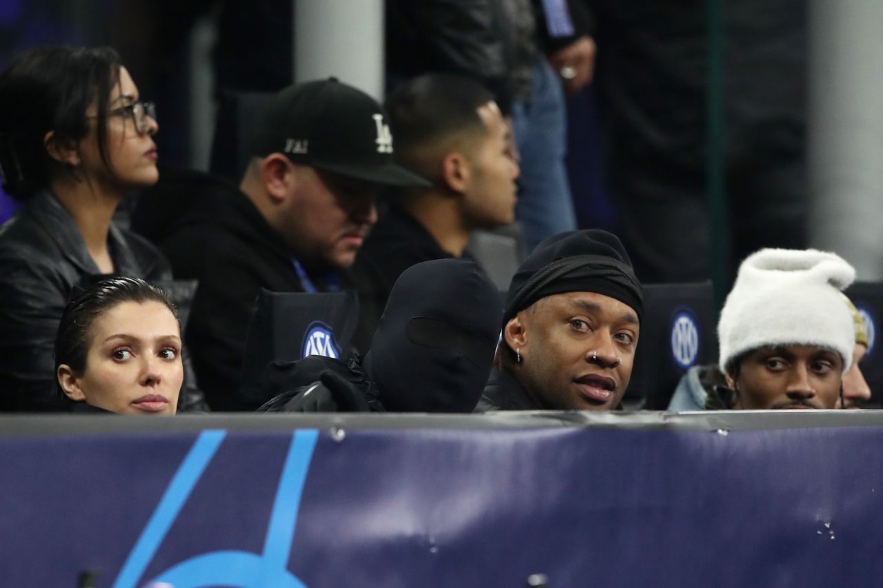 MILAN, ITALY - FEBRUARY 20: American musician and fashion designer, Kanye West, his partner Bianca Censori, and Amreican musician, Ty Dolla Sign, are seen in attendance during the UEFA Champions League 2023/24 round of 16 first leg match between FC Internazionale and Atletico Madrid at Stadio Giuseppe Meazza on February 20, 2024 in Milan, Italy. (Photo by Marco Luzzani/Getty Images)