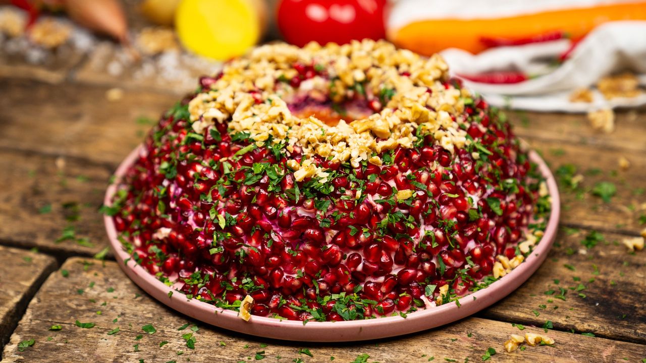 Salad showstopper: Vibrant layers with pomegranate flair