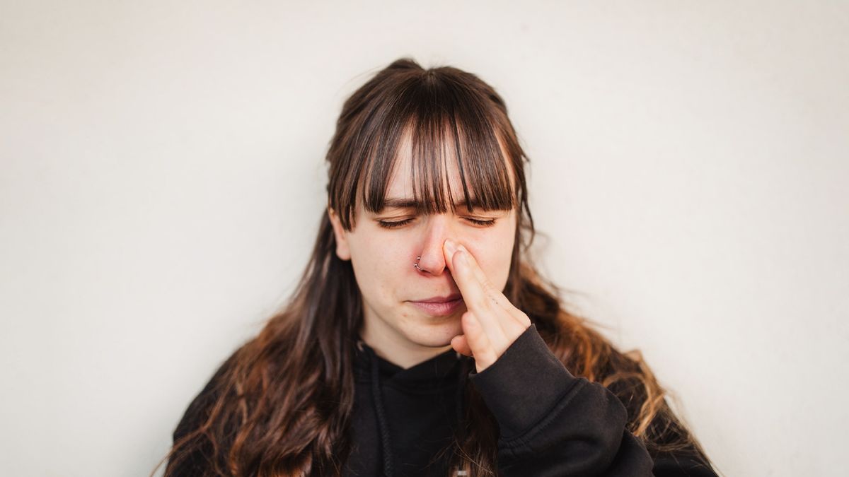 close uo view of young woman suffering spring allergy
woman with itchy nose from allergy
raquel arocena torres