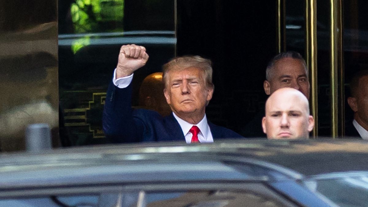 Former President Donald Trump waves to supporters before heading to Manhattan Criminal Court for his arraignment, at Trump Tower, Manhattan, New York, Tuesday, April 4, 2023. (Shawn Inglima/New York Daily News/Tribune News Service via Getty Images)