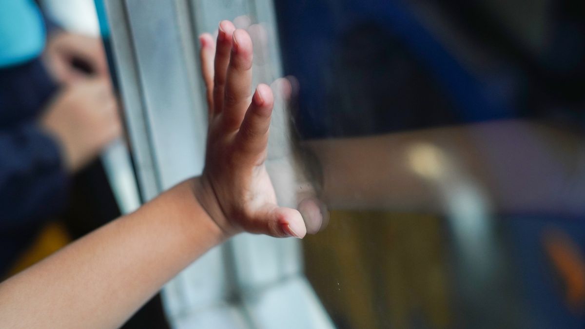 Young baby boy looking through a window,child's hand on the window
Fajrul Islam