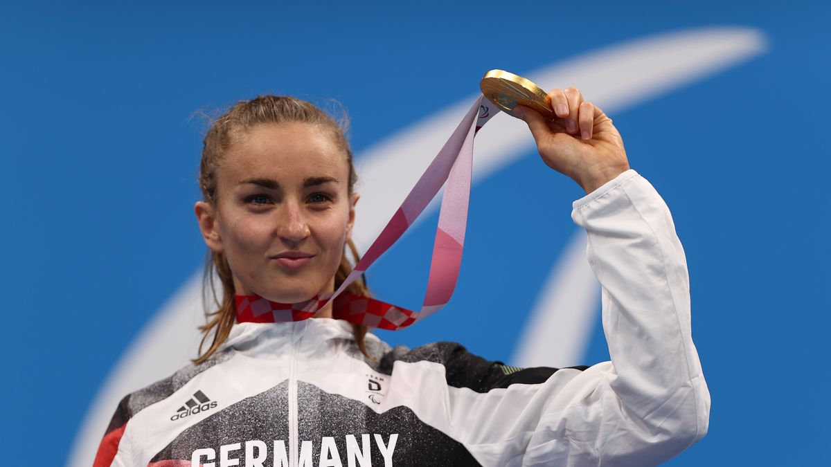 TOKYO, JAPAN - SEPTEMBER 01: Gold medalist Elena Krawzow of Team Germany reacts during the women’s 100m Breaststroke - SB13 medal ceremony on day 8 of the Tokyo 2020 Paralympic Games at Tokyo Aquatics Centre on September 01, 2021 in Tokyo, Japan. (Photo by Dean Mouhtaropoulos/Getty Images for New Zealand Paralympic Committee)