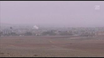 Czarne kłęby gęstego dymu unoszą się nad Kobane; trwa walka o kontrolę nad miastem