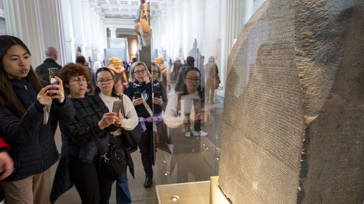 Visitors viewing and takng pictures of the Rosetta Stone at the British Museum on 25th March 2025 in London, United Kingdom. The British Museum is a public museum dedicated to human history, art and culture located in the Bloomsbury area of London. It has a permanent collection of eight million works and is among the largest and most comprehensive collection, which documents the story of human culture from its beginnings to the present. (photo by Mike Kemp/In Pictures via Getty Images)