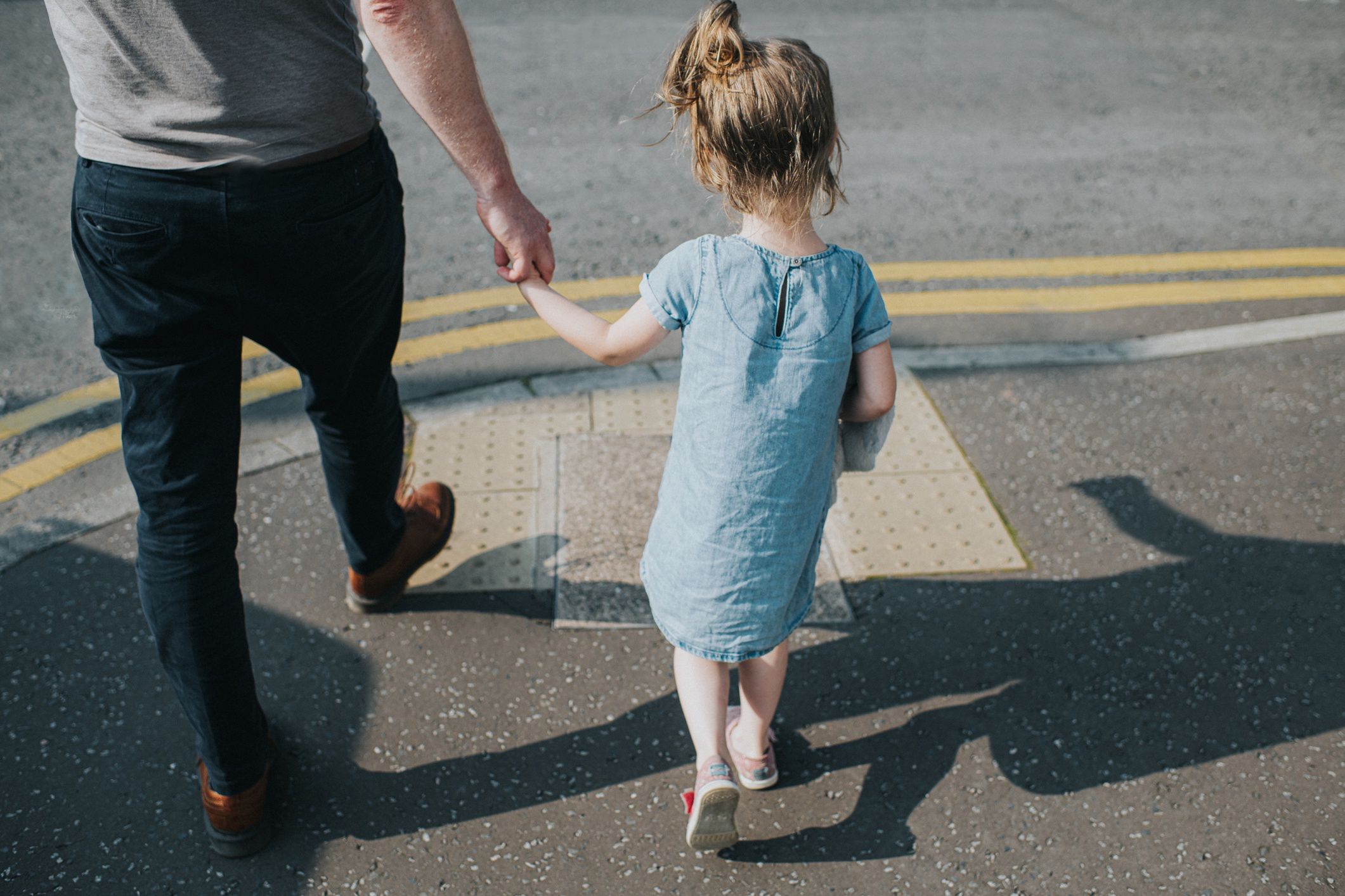 Little girl holding her Father's hand, about to cross a Road
Father and daughter walking along a footpath, in sun, casting shadows on the ground as they come to the edge of the footpath to cross the road. Double yellow lines and tarmac give a sense of a city.
Catherine Falls Commercial