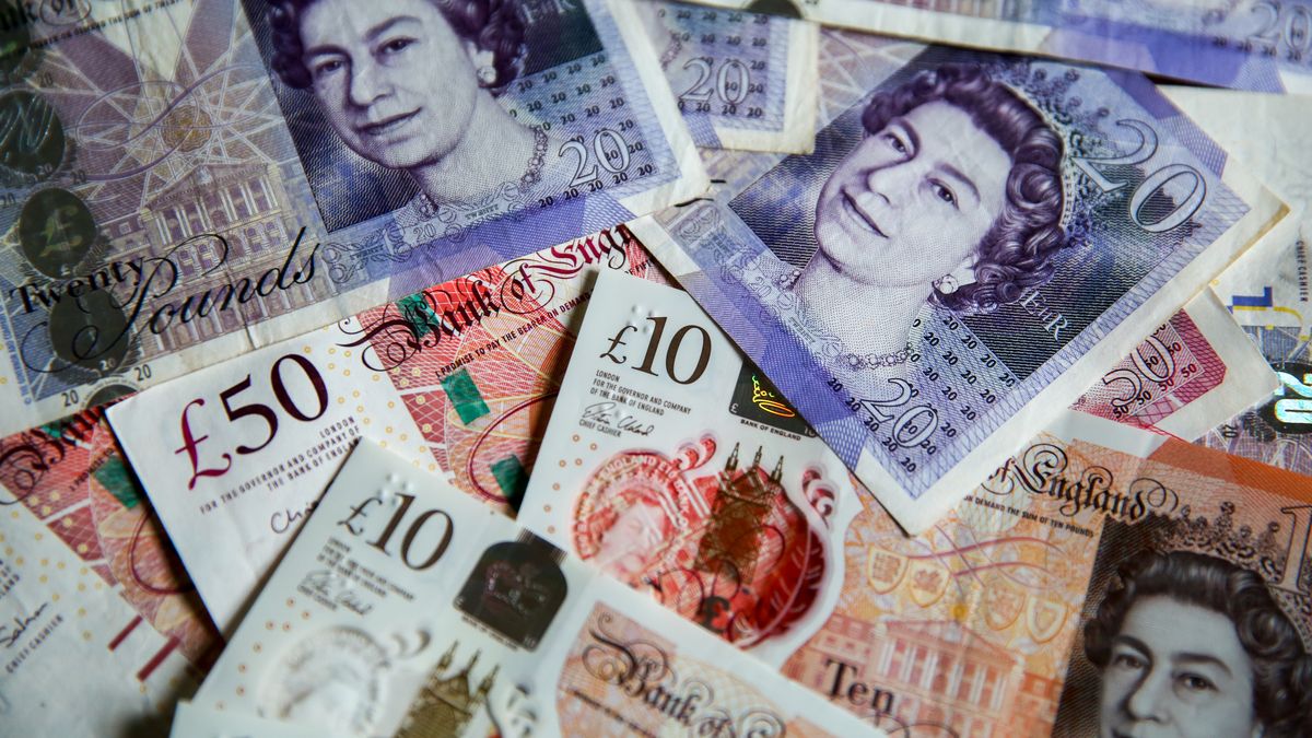 UNITED KINGDOM - 2019/08/07: In this photo illustration, British Pound sterling banknotes are seen as Pound to US Dollar exchange rates are now trading close to a 2 ½ year low, with the Pound now trading under 1.21 on the inter-bank exchange against US dollar. If the UK leaves the European Union without a deal on 31  2019, it is forecasted that the Pound will fall to the lowest level since 1985 against US Dollar. (Photo Illustration by Steve Taylor/SOPA Images/LightRocket via Getty Images)