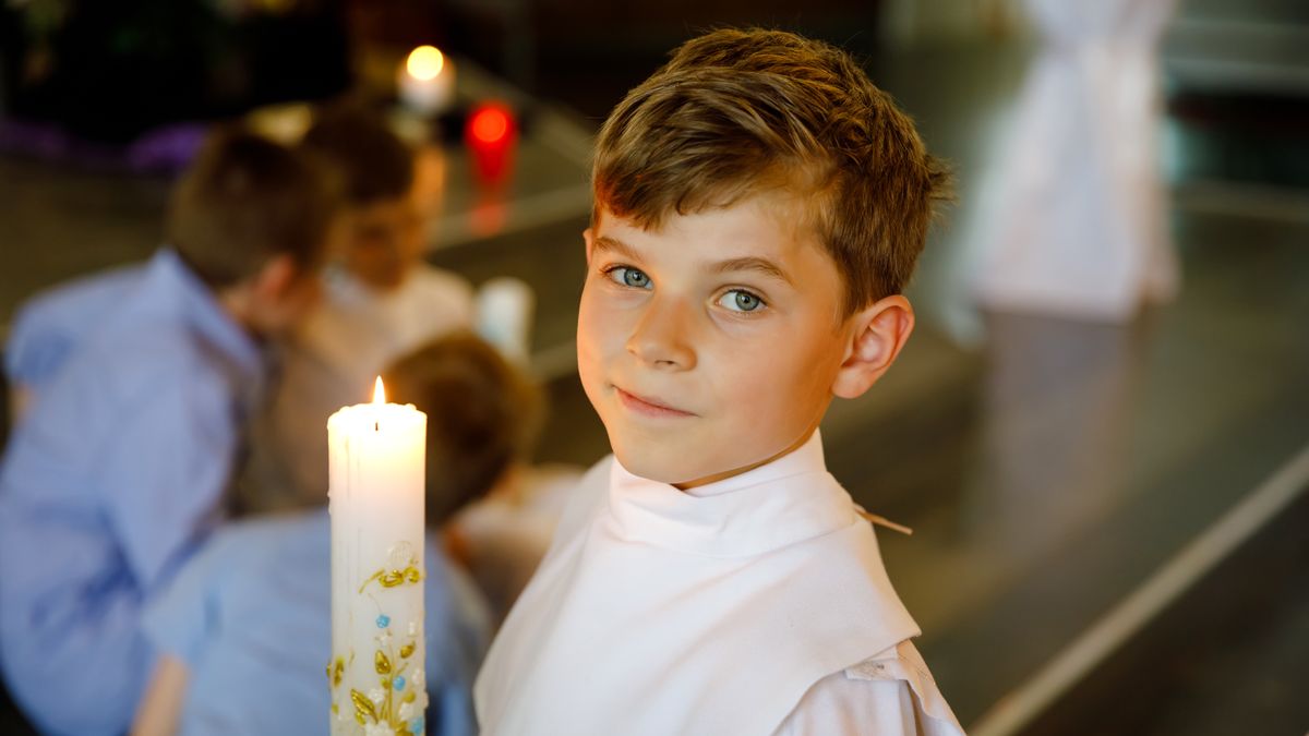 pierwsza komunia święta komunie prezent komunijny kid boy receiving his first holy communion. Happy child holding Christening candle. Tradition in catholic curch. Kid in a white traditional gown in a church near altar.Little kid boy receiving his first holy communion. Happy child holding Christening candle. Tradition in catholic curch. Kid in a white traditional gown in a church near altarboy, altar, catholic, priest, communion, confirmation, holy, child, first, jesus, celebration, religion, beautiful, cathedral, caucasian, ceremony, cheerful, childhood, christ, christianity, church, day, dress, going, holding, kid, looking, person, portrait, pray, pretty, religious, sacrament, smiling, spirituality, symbol, white, young, candle, tradition, traditional, happy, healthy, health, gown, garment