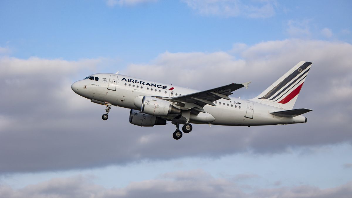 Air France Airbus A318 aircraft as seen during take off and flying phase from Amsterdam Schiphol Airport. The narrow body A318 is departing from Polderbaan runway and passes in front of the control tower performing a flight to Paris. AirFrance AF AFR is the French airline flag carrier, subsidiary of Air France-KLM Group and member of SkyTeam aviation alliance. As the Covid-19 Coronavirus pandemic measures are suspended the aviation, travel and tourism industry are having increased demand for flights. Since May 16, 2022 the mandatory usage of facemasks in airplane and airport is lifted.  Amsterdam, the Netherlands on April 27, 2022  (Photo by Nicolas Economou/NurPhoto via Getty Images)