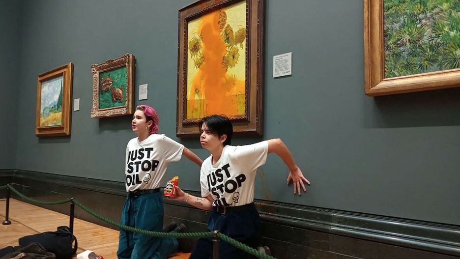 Temporary
A handout picture from the Just Stop Oil climate campaign group shows activists with their hands glued to the wall under Vincent van Gogh's "Sunflowers" after throwing tomato soup on the painting at the National Gallery in central London on October 14, 2022. - London's Metropolitan Police said its officers arrested two protesters from the Just Stop Oil group for criminal damage and aggravated trespass after they "threw a substance over a painting" at the gallery on Trafalgar Square. (Photo by Handout / Just Stop Oil / AFP) / RESTRICTED TO EDITORIAL USE - MANDATORY CREDIT "AFP PHOTO /  JUST STOP OIL " - NO MARKETING - NO ADVERTISING CAMPAIGNS - DISTRIBUTED AS A SERVICE TO CLIENTS
HANDOUT