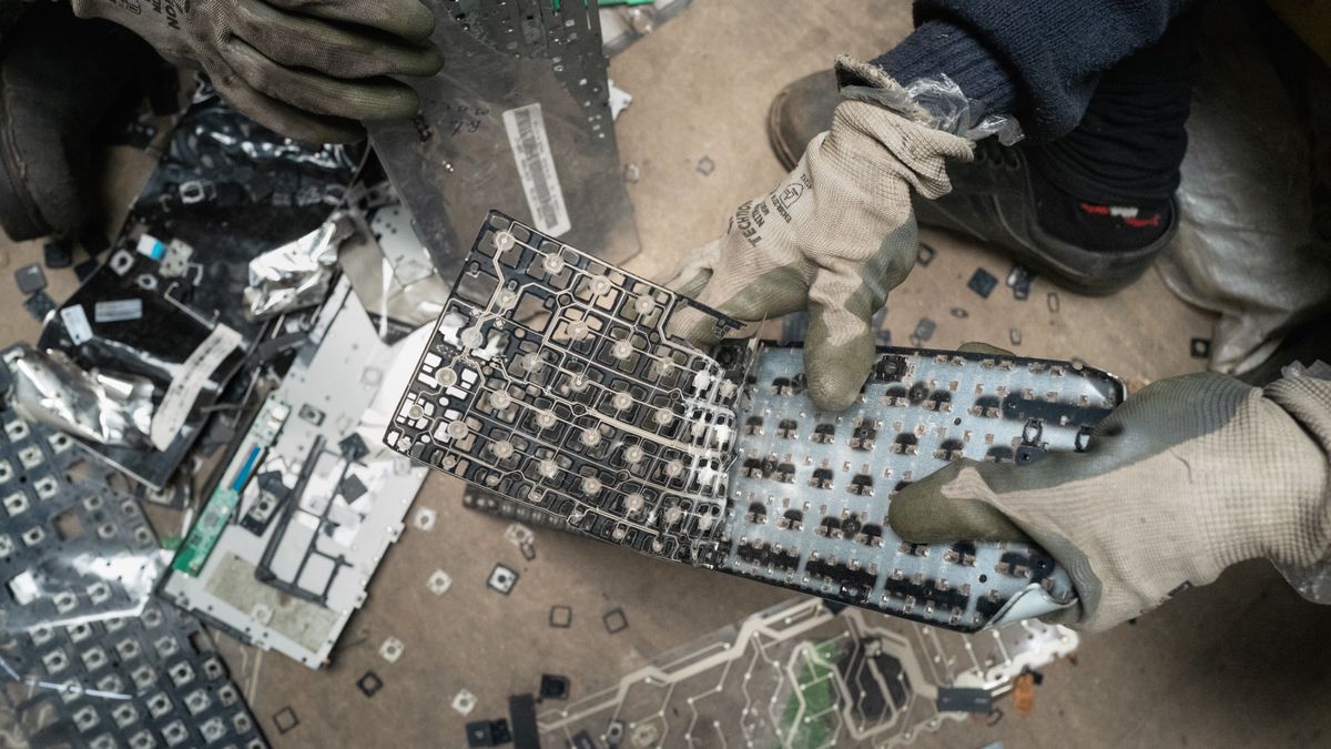 BENGALURU, INDIA - AUGUST 09: Workers dismantle electronic waste at E-Parisaraa on August 09, 2024 in Bengaluru, India. India is the third largest electronic waste producer in the world and generates approximately 2 million tons of e-waste annually. Computer devices account for nearly 70% of e-waste. Although efforts are made to formalise e-waste, more than 95% is illegally recycled by informal waste pickers. (Photo by Elke Scholiers/Getty Images)