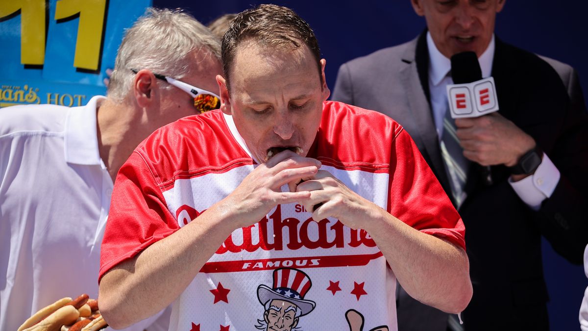 NEW YORK, USA - JULY 04: Joey Chestnut won first place eating 63 hot dogs in 10 minutes during the men 2022 Nathan's Famous International Hot Dog Eating Contest in Coney Island of the Brooklyn borough in New York City, United States on July 4, 2022. (Photo by Tayfun Coskun/Anadolu Agency via Getty Images)