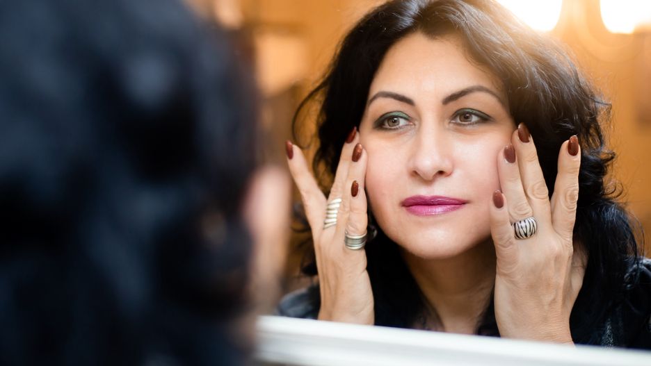 Beautiful middle aged woman checking her wrinkles in the mirror. Skin careBeautiful middle aged woman checking her wrinkles in the mirror. Skin carestivoghands, confident, rejuvenation, elegance, eyes, purity, natural, lift, black, brunette, cosmetology, attractive, aging, complexion, facial, smile, cosmetics, cosmetic, age, checking, check, mirror, looking, moisturizer, mature, anti-aging, clear, wellness, treatment, wrinkle, fresh, healthy, portrait, cream, body, old, health, white, happy, middle, clean, care, female, beautiful, skincare, skin, woman, beauty, face, lifting